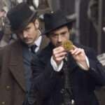 man look a a golden coin