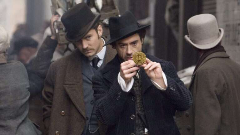 man look a a golden coin