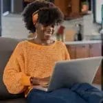 woman happy on her laptop